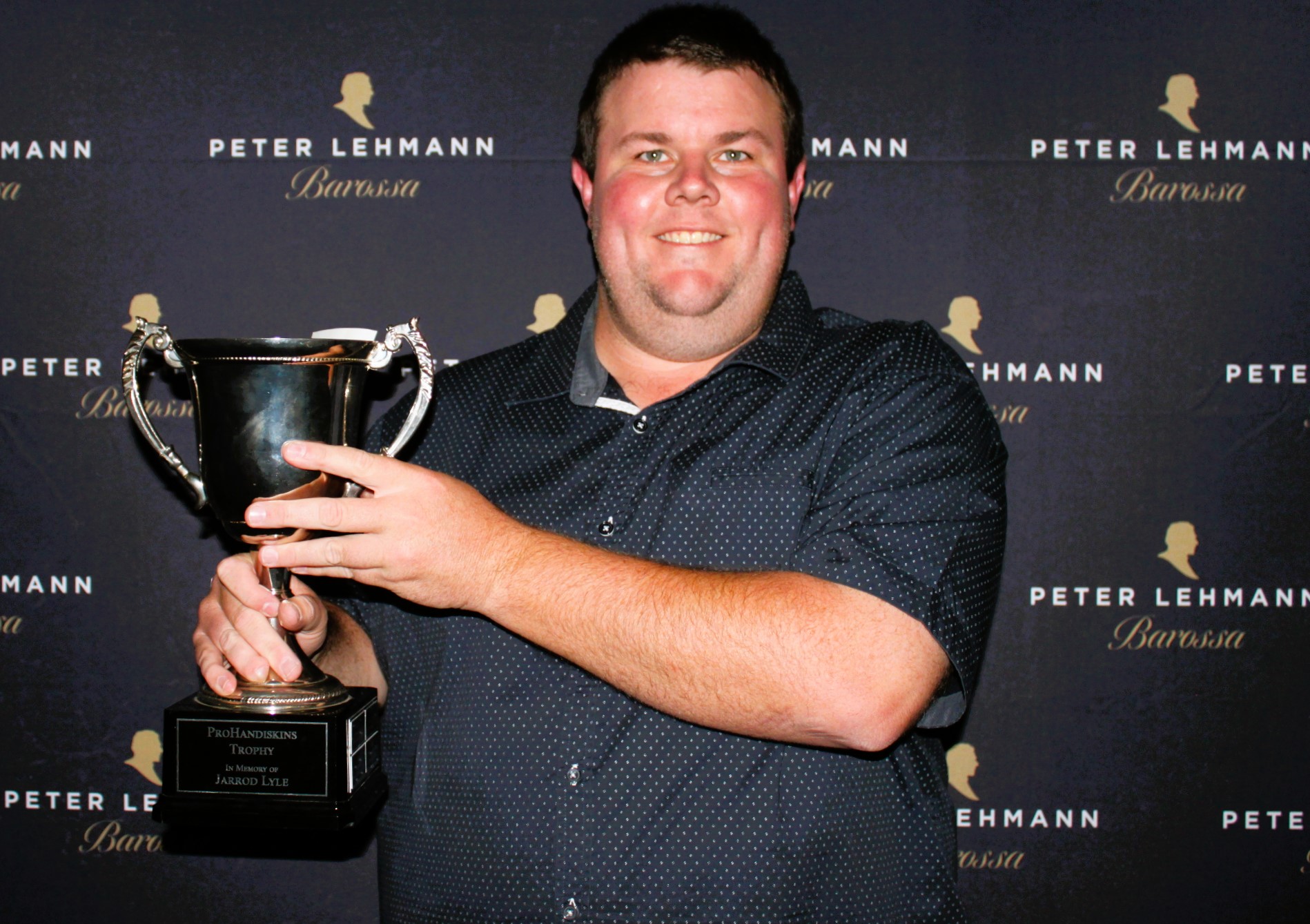 Jamie Hook with the Jarrod Lyle Memorial Trophy in 2024